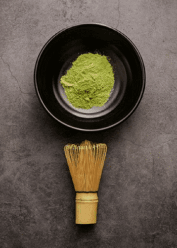Premium Green Batak Kratom powder in a bowl with a brush